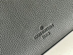 Black textured leather bag with embossed brand logo on side panel