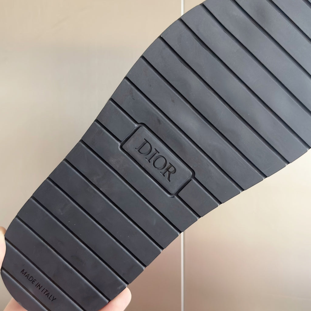 Black rubber outsole for slide sandals with DIOR logo and MADE IN ITALY text