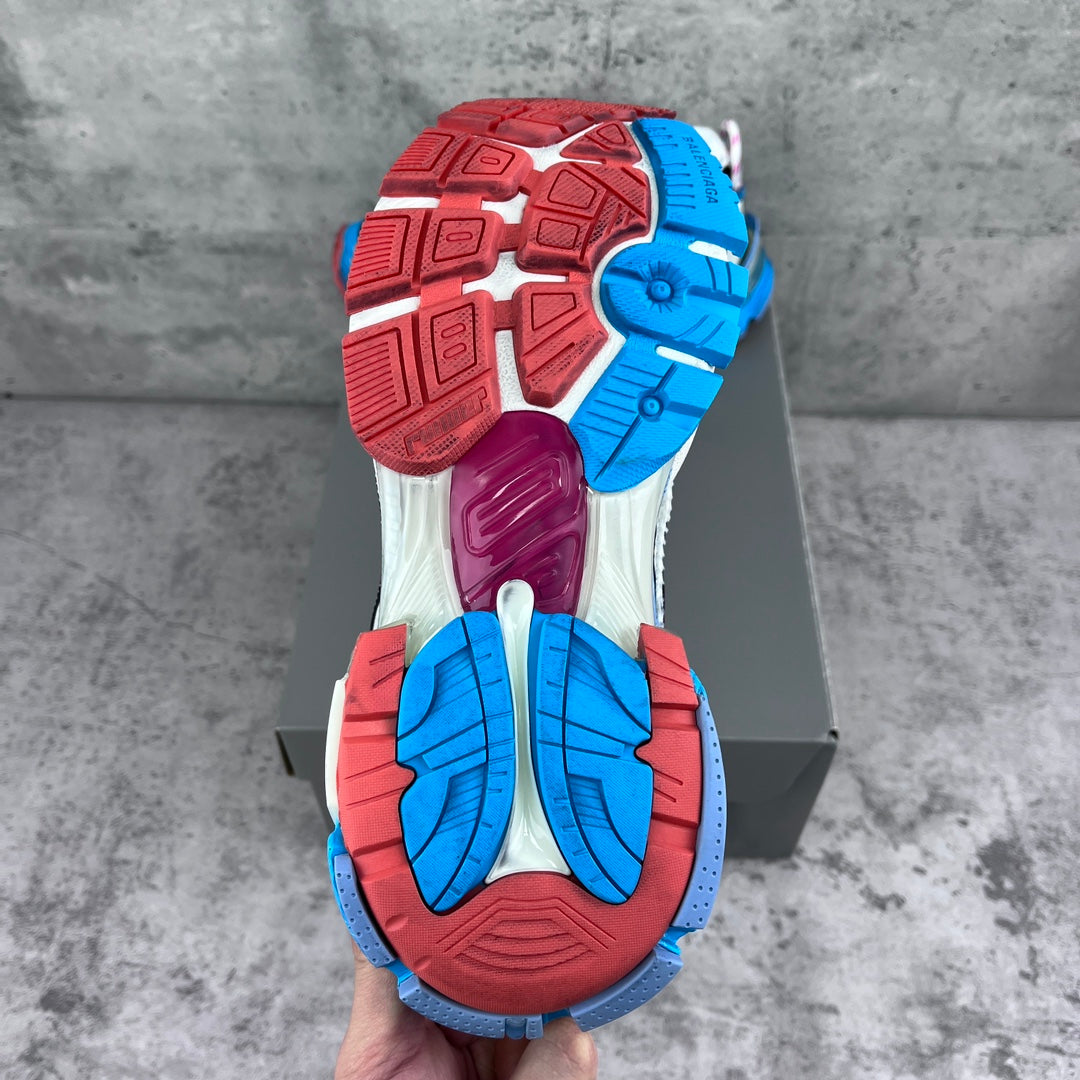 Balenciaga unisex runner outsole view, red and blue tread on gray-white shoe