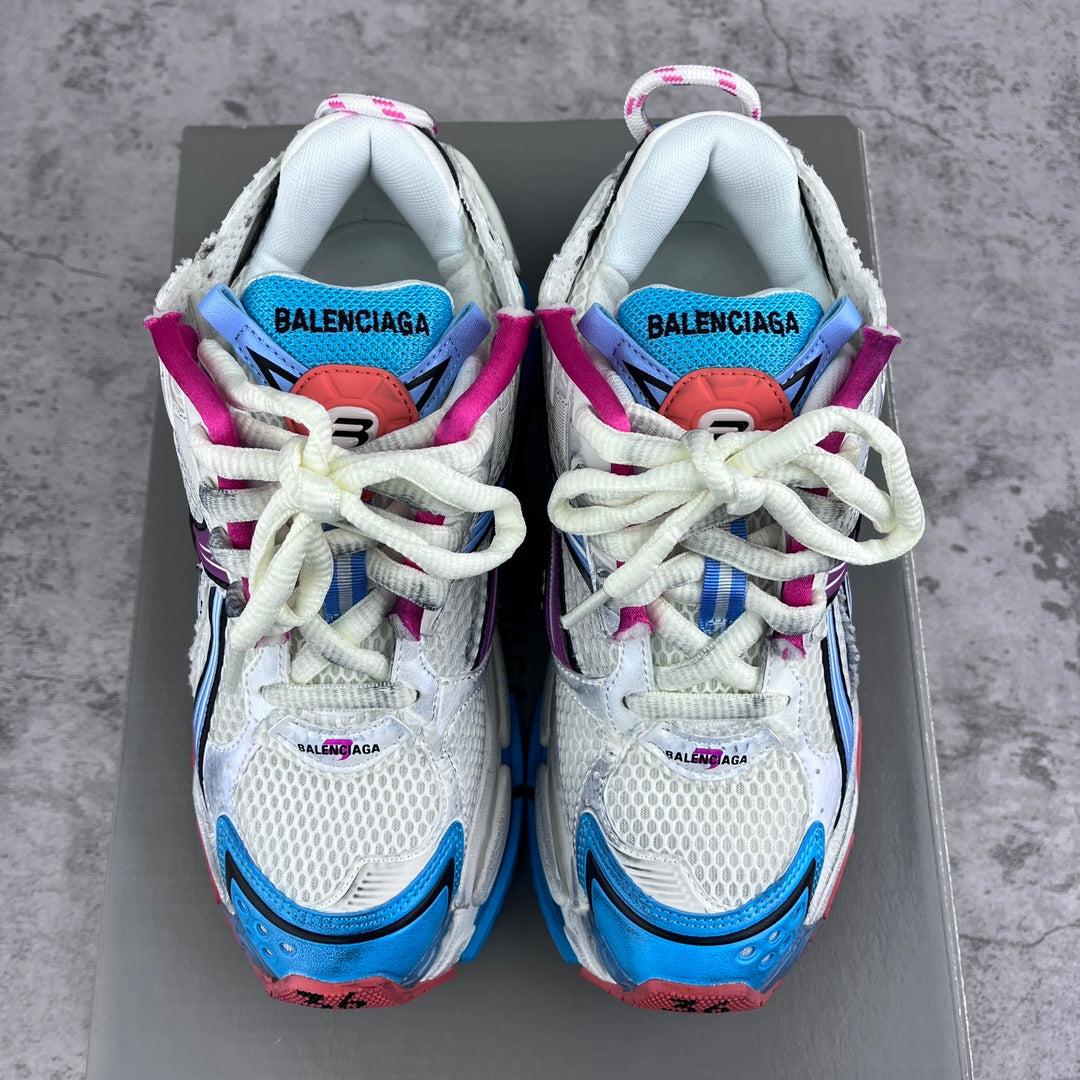 Balenciaga runner sneakers, front view of white uppers with blue, purple and magenta details