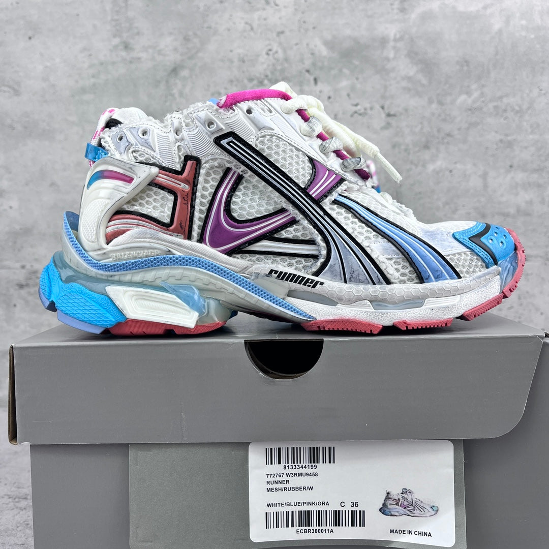 Balenciaga unisex runner sneakers in white, blue and purple, shown with shoe box