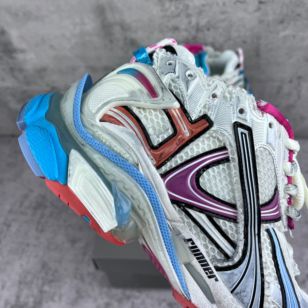 Balenciaga unisex runner sneakers, angled side view with white upper and colorful panels