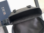 Dior bag open top view with interior lining and top flap strap hardware.