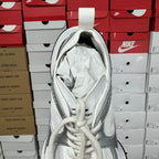 White unisex sneaker interior with padded opening and lace-up laces