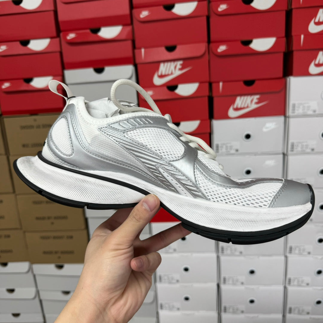 White unisex sneakers with mesh panels and sculpted midsole