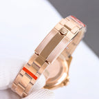 Rolex watch bracelet clasp in rose-gold tone with red accent bars and hinged links.