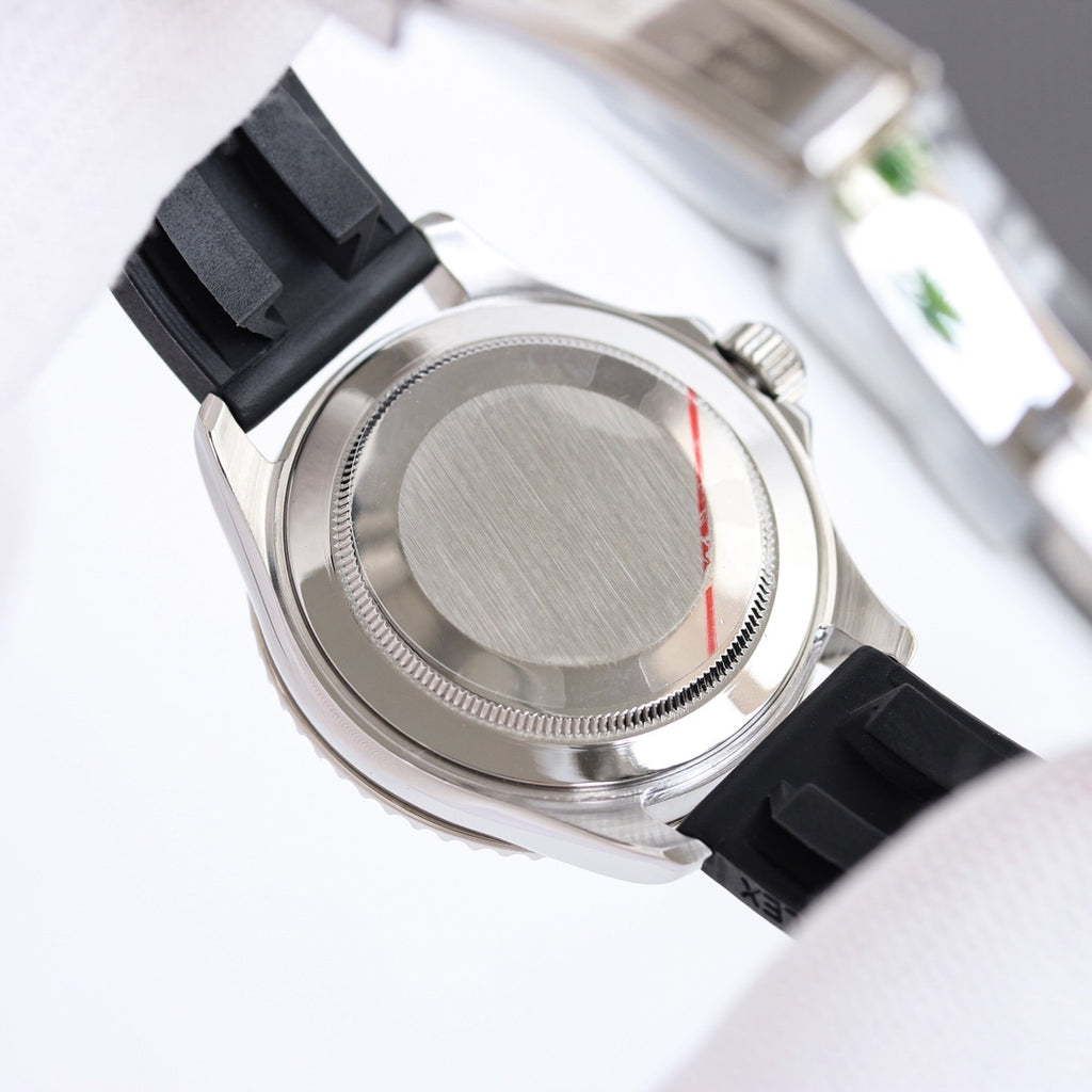 Stainless-steel watch case with black rubber strap, seen from the side
