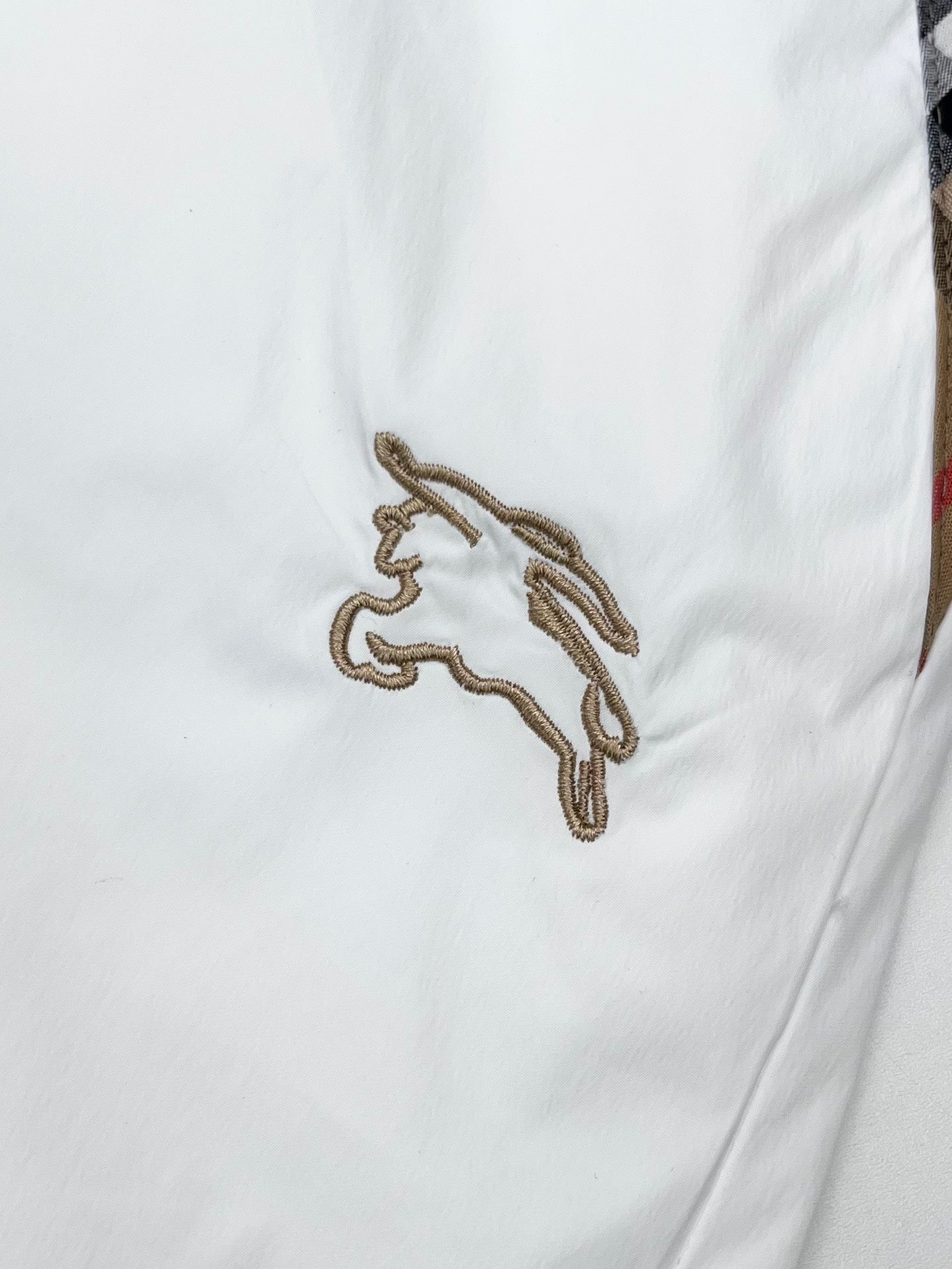 Burberry white shorts with embroidered horse logo on the front
