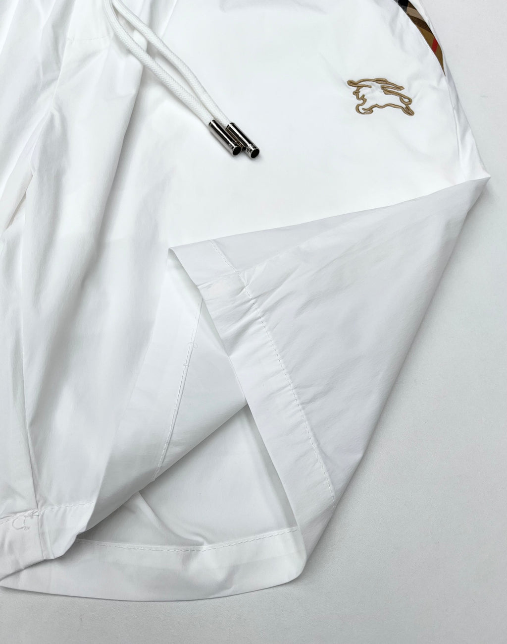 Burberry white shorts with drawstring ends and stitched pocket at the hem