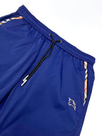 Blue Burberry shorts close-up with drawstring and embroidered horse logo