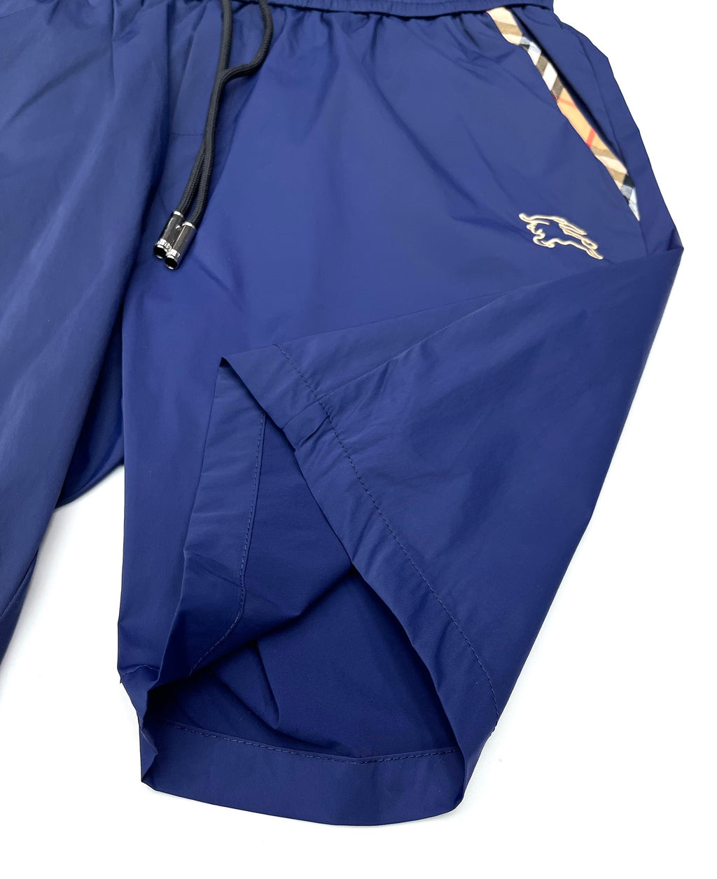 Blue Burberry shorts with zip pocket, drawstring cord, and horse logo