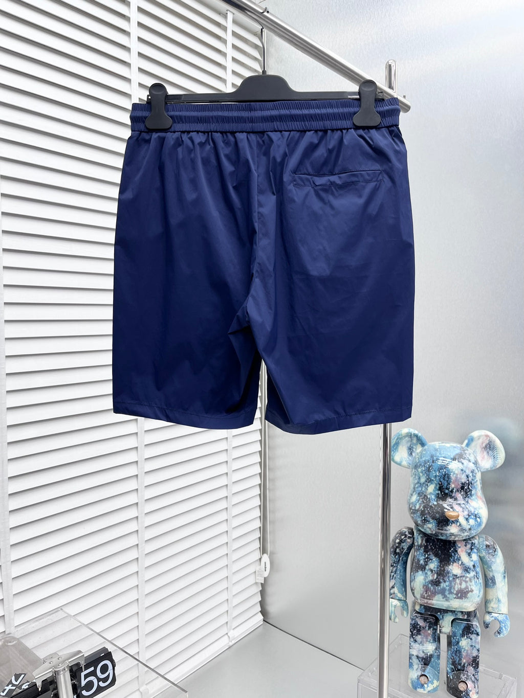 Blue Burberry swim shorts with elastic waist, drawstring, and side logo detail