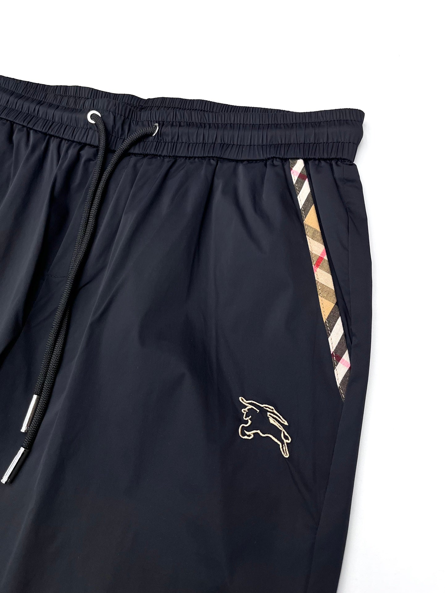 Dark navy Burberry shorts with elastic waistband, drawstring and side stripe trim