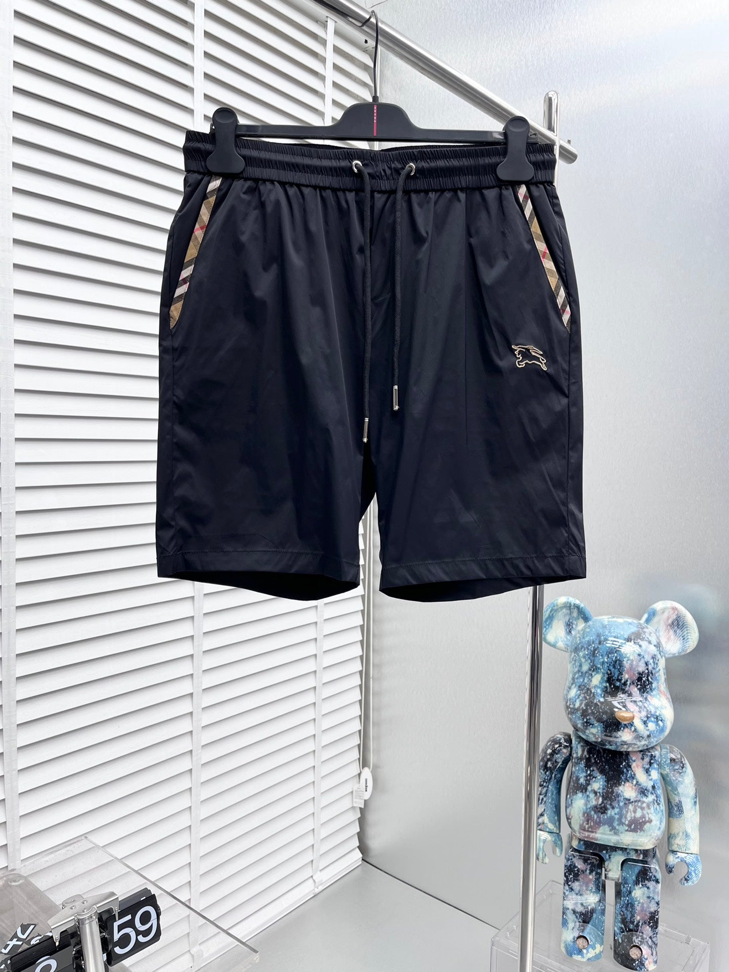 Dark navy Burberry shorts with elastic waistband and drawstring, side pockets