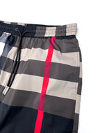 Burberry check shorts waist close-up with elastic band and drawstring