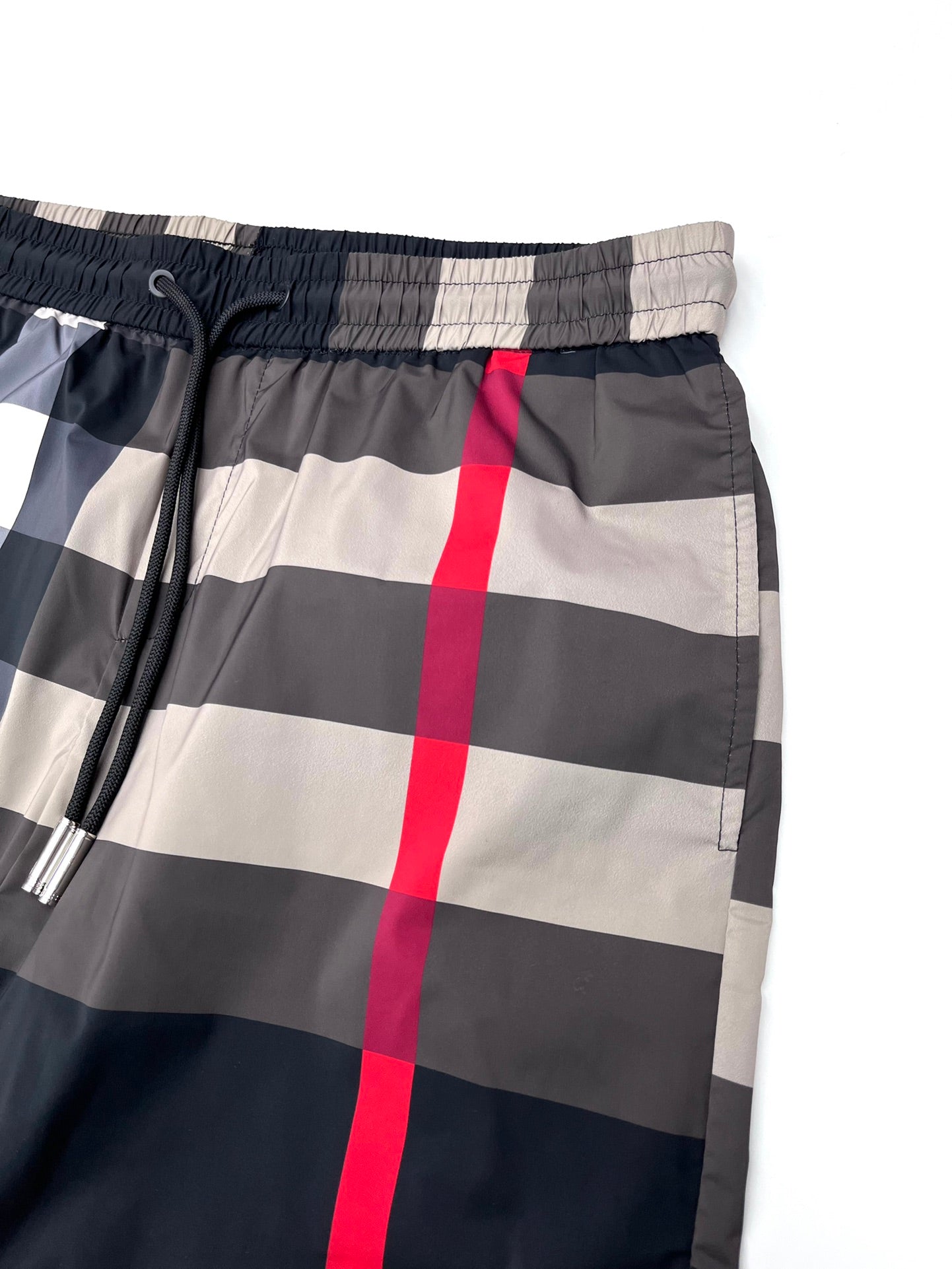 Burberry check shorts waist close-up with elastic band and drawstring