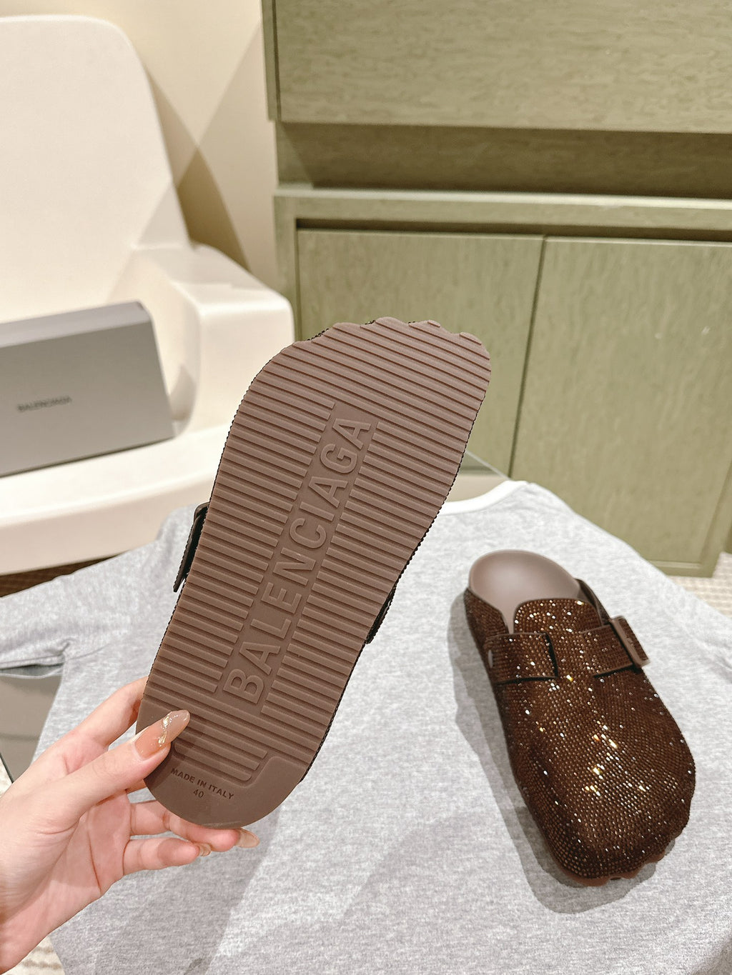 Balenciaga sandal outsole with raised texture and dark brown rubber sole