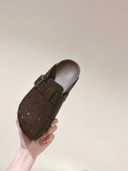 Balenciaga sandals held in hand, dark brown sparkly upper with buckle strap