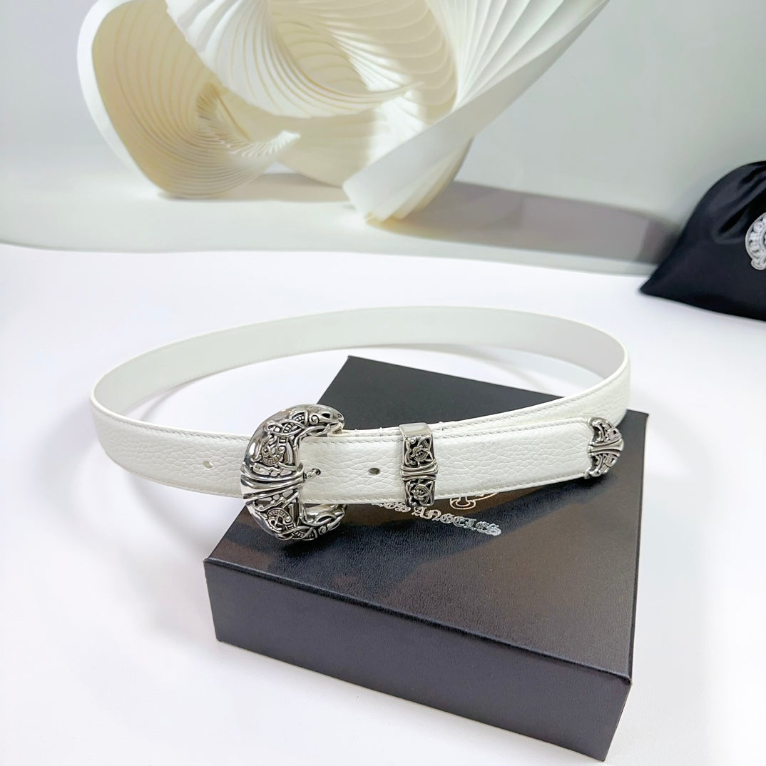 White leather belt with ornate silver buckle and decorative metal end caps