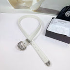 White leather belt with silver filigree buckle and adjustable strap with punched holes