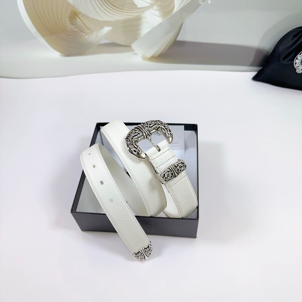 White leather belt laid in box with silver filigree buckle hardware and end ornaments