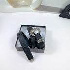 Dark leather belt with ornate silver buckle and keeper, displayed in a gift box