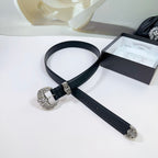 Dark leather belt with ornate silver buckle and decorative side clips, laid out flat