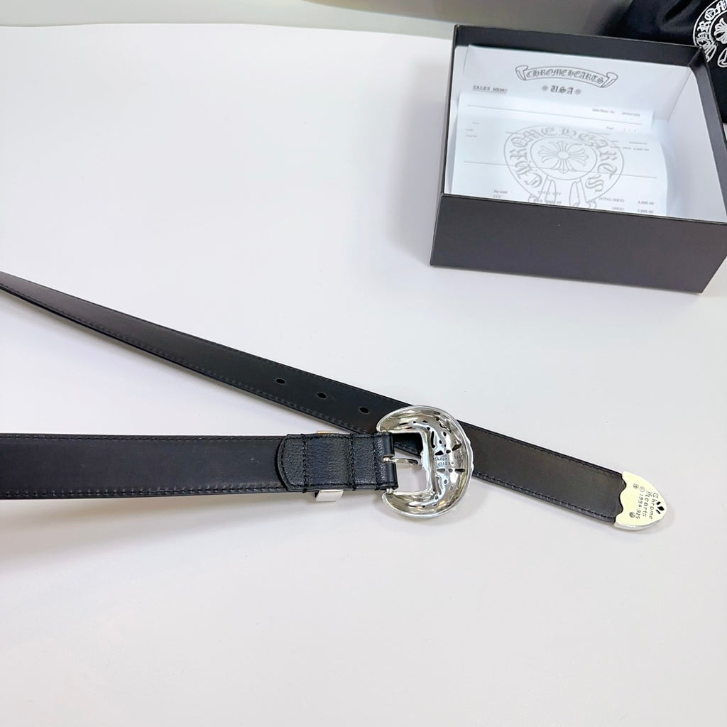 Black leather belt with large circular silver buckle and adjustable strap holes