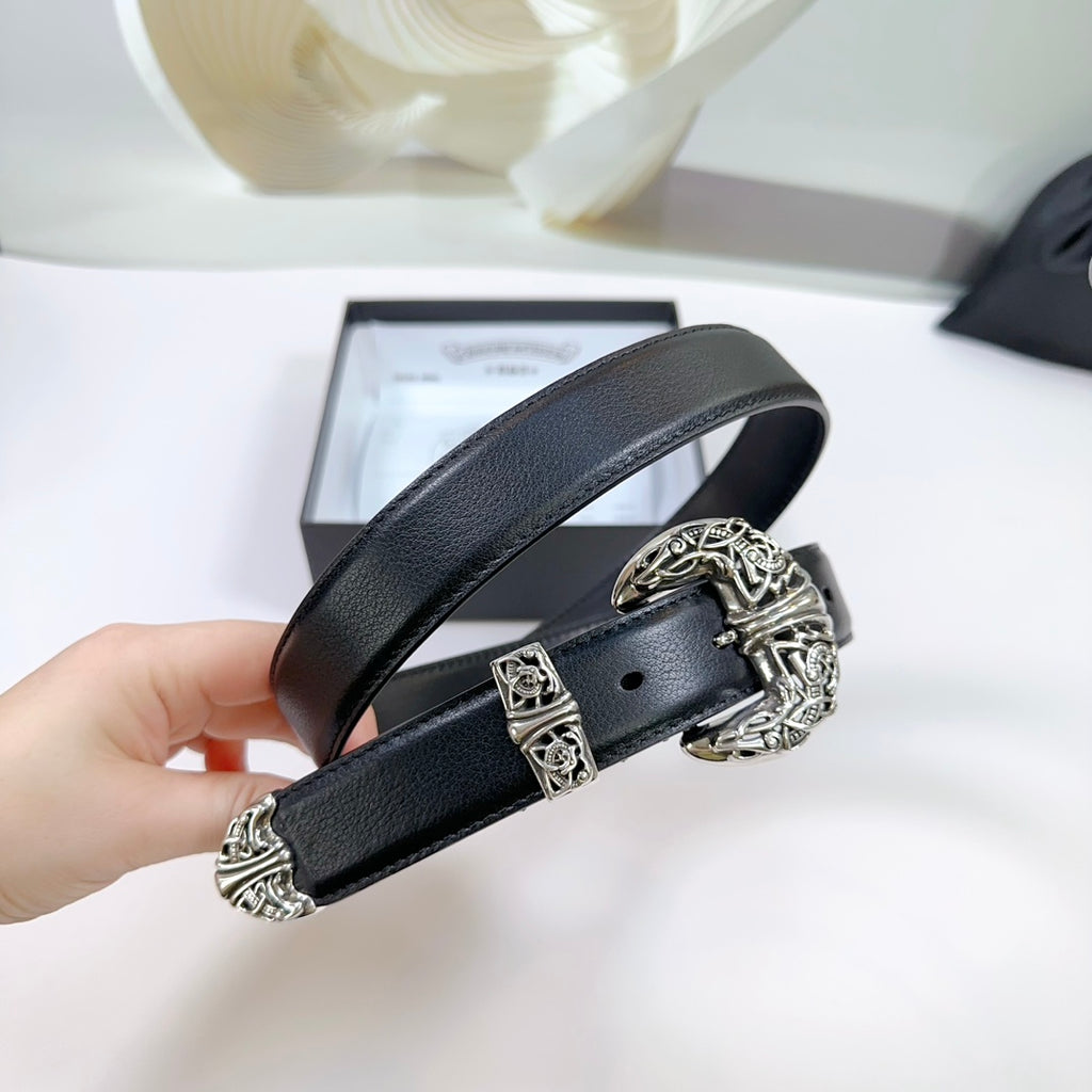 Black leather belt held up, ornate silver buckle with engraved details