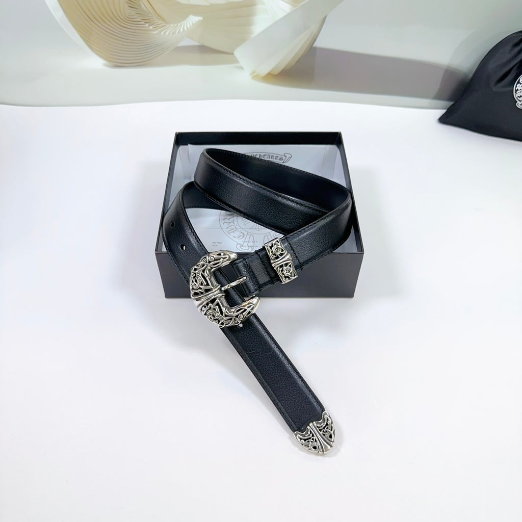 Black leather belt with decorative silver buckle and stitched holes, top view