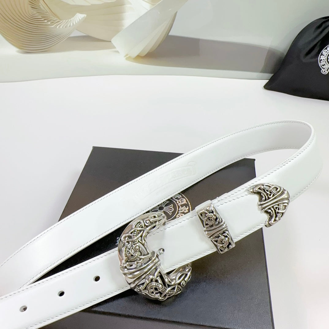 White leather belt with ornate silver buckle and keeper, close-up on center hardware