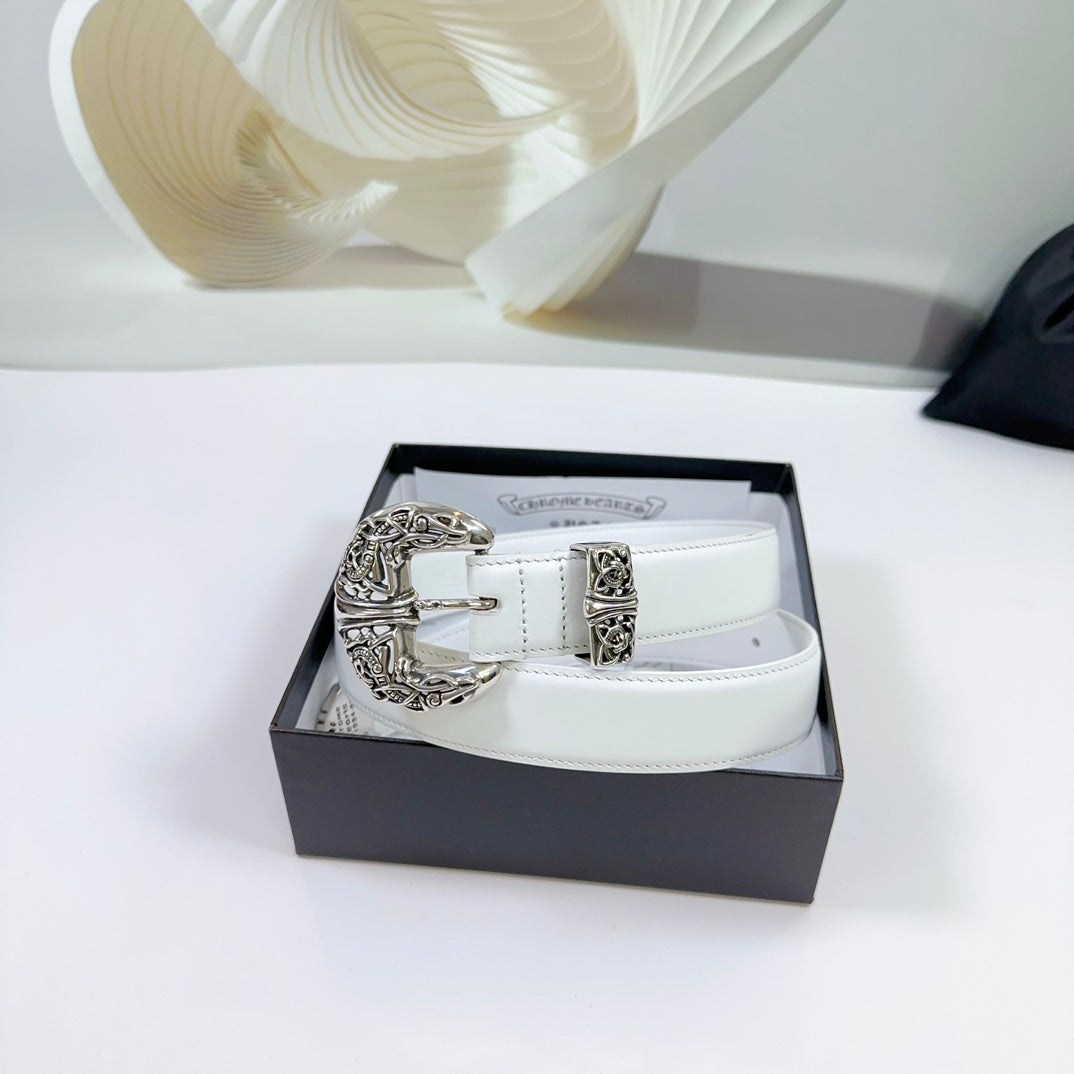 White leather belt with ornate silver buckle resting in a gift box