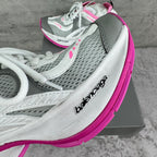 Balenciaga sneaker side profile with gray mesh panels and pink edge detail, lace-up