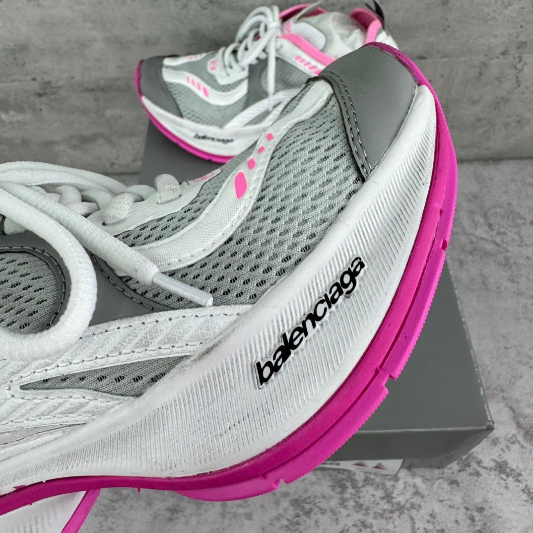 Balenciaga sneaker side profile with gray mesh panels and pink edge detail, lace-up