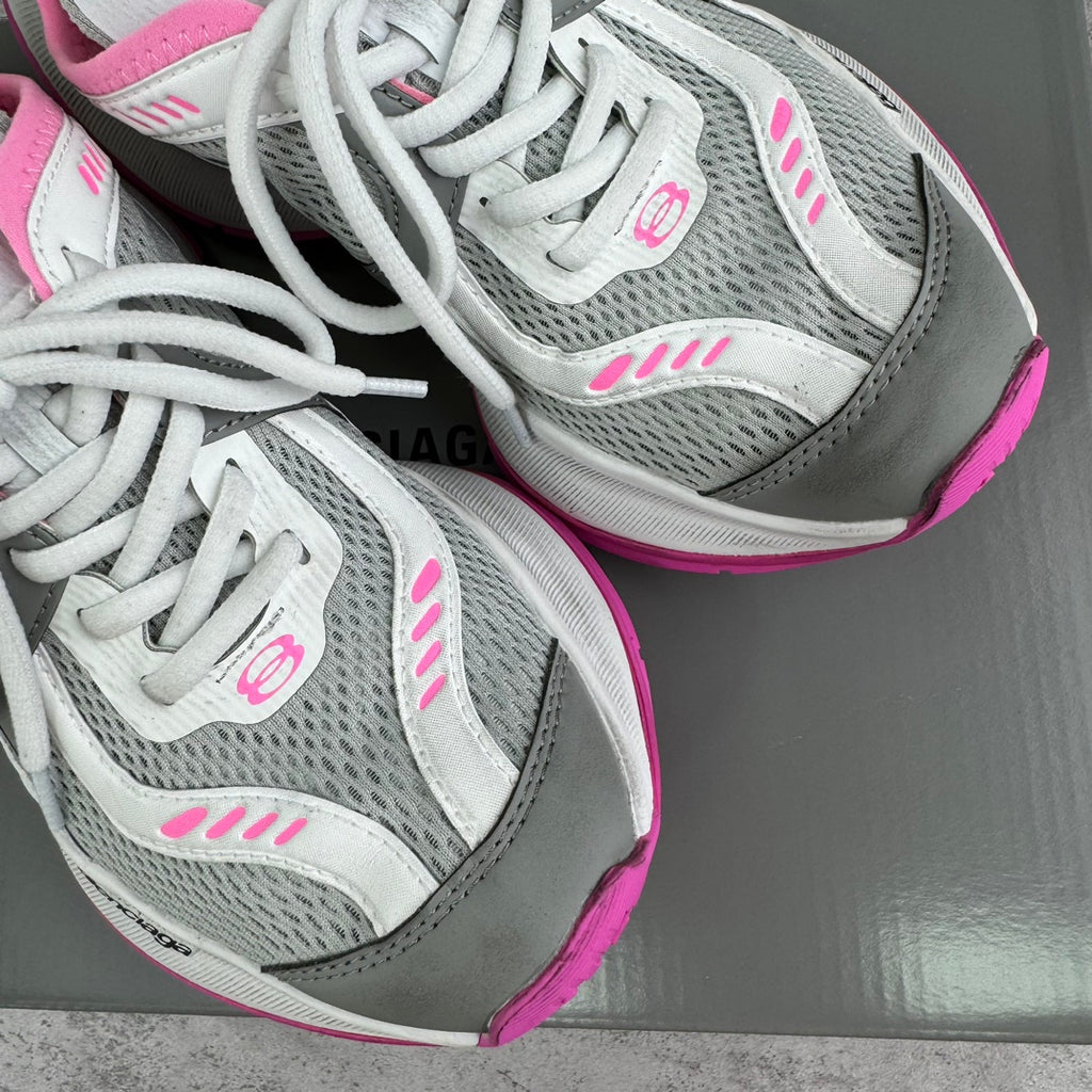 Balenciaga sneakers close-up: white laces, gray mesh uppers, pink accent stripes