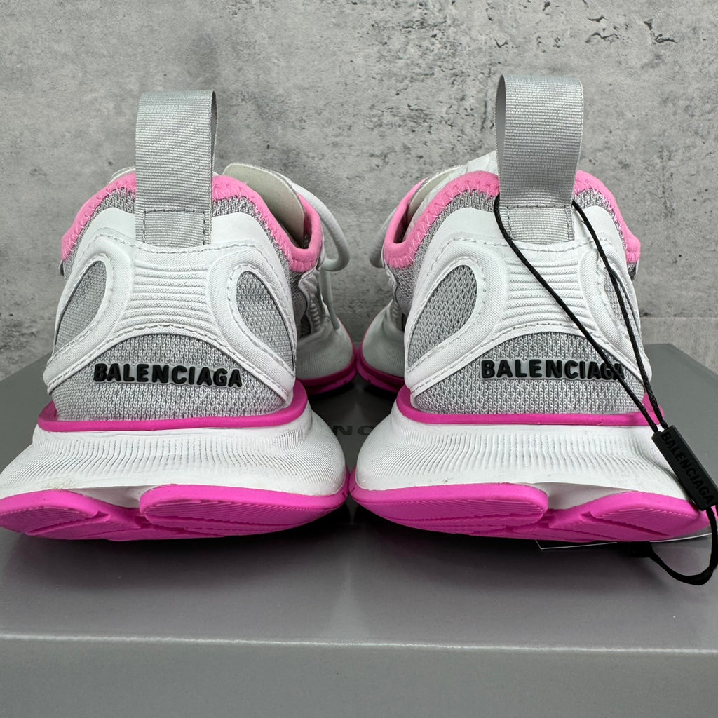 Balenciaga sneakers heel view with “BALENCIAGA” on back, white upper and pink trim