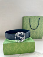 Gucci belt with dark blue patterned strap and gold-toned double-G buckle