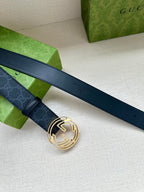 Gucci belt with dark blue patterned strap and gold-toned double-G buckle