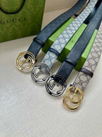 Gucci belts with dark blue straps and different double-G buckles: gold, silver, black