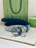 Gucci belt with blue GG patterned strap and dark blue leather, silver interlocking G buckle
