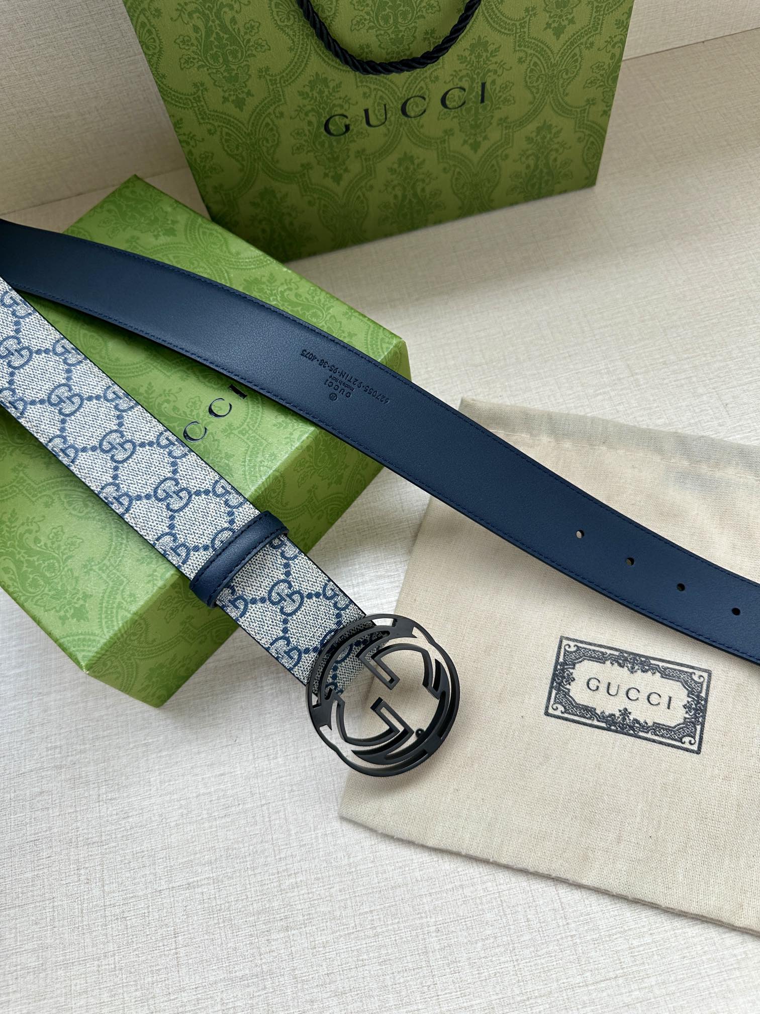 Gucci belt with blue GG canvas and dark blue leather strap, silver interlocking G buckle