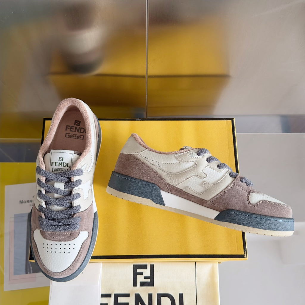 Fendi sneakers on display, cream and brown uppers with dark blue side strap