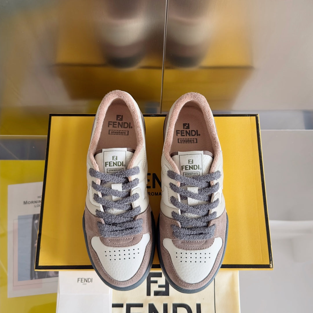 Pair of Fendi lace-up sneakers with cream uppers, brown accents and dark blue detail