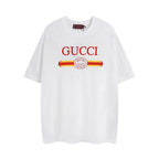 White Gucci T-shirt with red “GUCCI” logo and striped graphic at chest