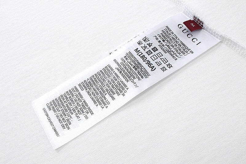 White Gucci T-shirt care label at inner collar