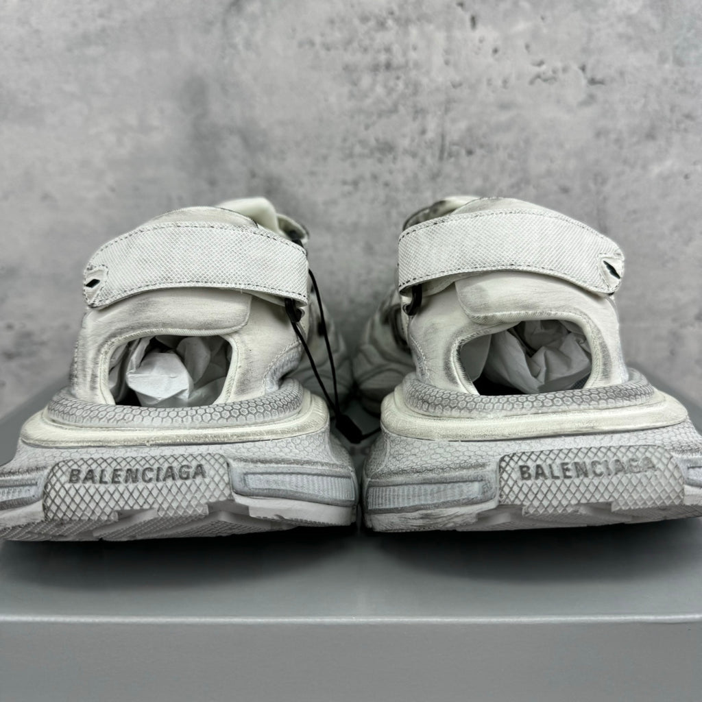 Balenciaga unisex sneakers from heel view, light gray midsoles with branding