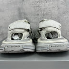 Balenciaga unisex sneakers from heel view, light gray midsoles with branding