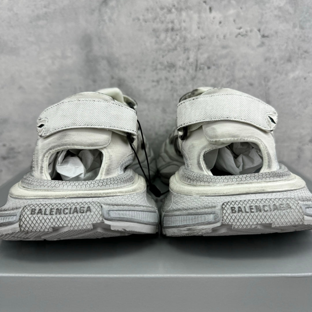 Balenciaga unisex sneakers from heel view, light gray midsoles with branding