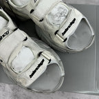Balenciaga unisex sneakers in light gray, close-up of velcro straps and logo patch
