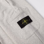 Light gray sweatpants with black patch logo on right front pocket